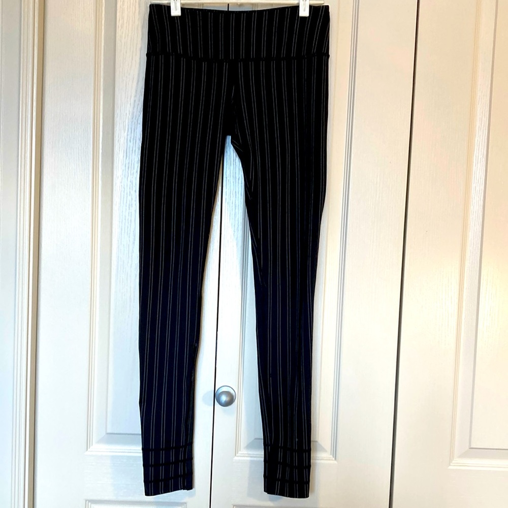 EUC. MPG black with white stripes leggings. Size small.
